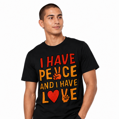 Male model wearing a black graphic T-shirt featuring “I HAVE PEACE AND I HAVE LOVE” comic-style artwork